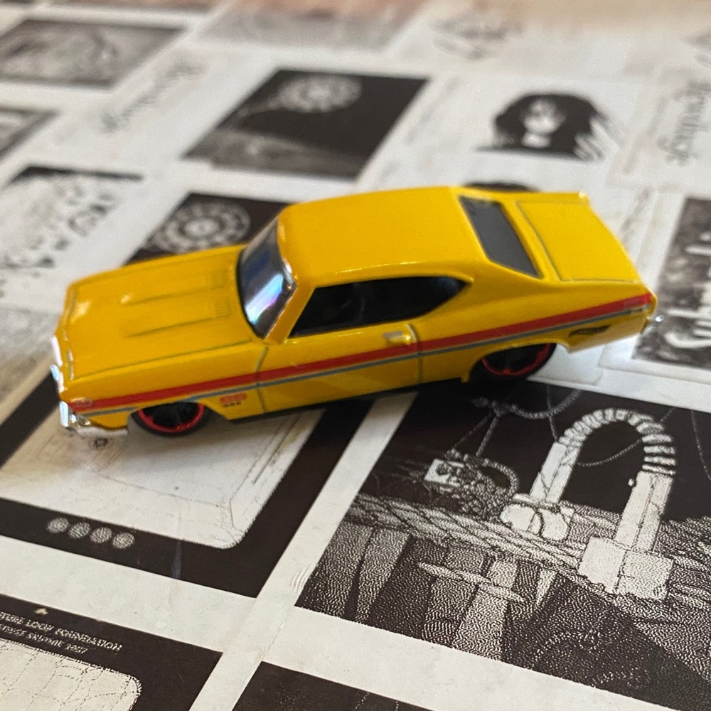 Classic Yellow Toy Car with Red Stripes